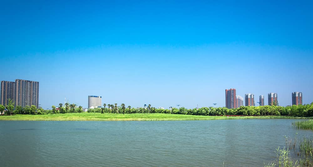 Municipal waterfront buildings and lake showing clean water environment after Sublime Environmental ozone treatment system installation