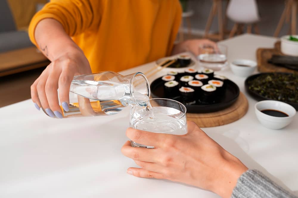 Chef preparing food with purified water from Sublime Environmental treatment systems for premium restaurant applications