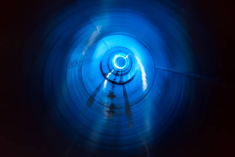Interior view of industrial piping system being cleaned with Sublime Environmental ozone CIP technology for superior sanitation results